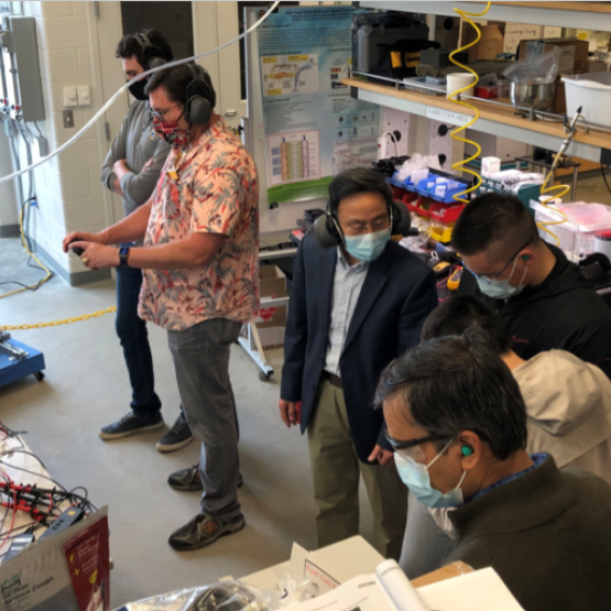 A lab demonstration of the hybrid fuel cell – battery/capacitor power source for UASs conducted at Dr.Du’s Fuel Cell Laboratory at Kent State University’s Kent Campus. The team completed a successful demonstration of 12-hours of operation of the technology. Principal Investigator Dr. Yanhai Du and Lab Demonstration Lead Dr. Blake Stringer are pictured at the center. 